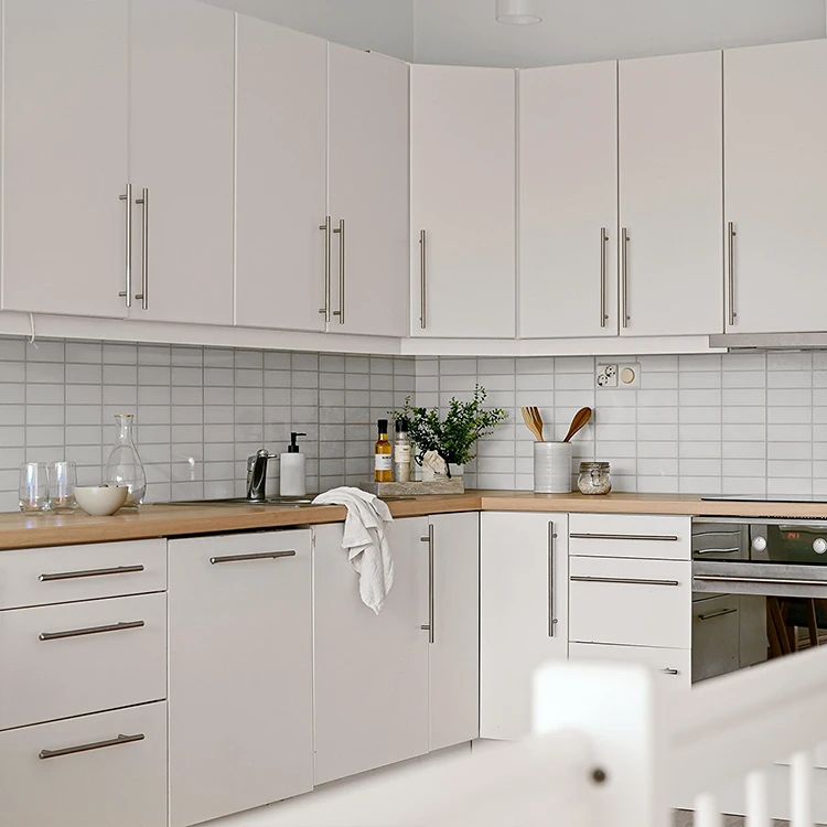 white cabinets and backsplash in kitchen