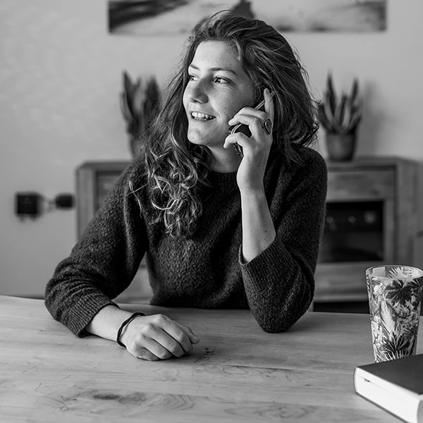 Black and white image of woman on phone